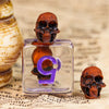Orange Skull Dice | Clear RPG 7-Dice Set w/ Purple Numbers
