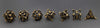 Gold Deadly Skull Dice Hollow Metal 7-Dice Set