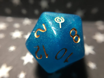 Jester Inspired D20 – Handmade Shimmering Blue Gaming Die with Metallic Gold Numbers & Lollipop Symbol