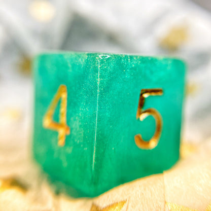Tusktooth Fjord Inspired D6 – Handmade Glow-in-the-Dark Green & Blue Gaming Die with Gold Grinning Face