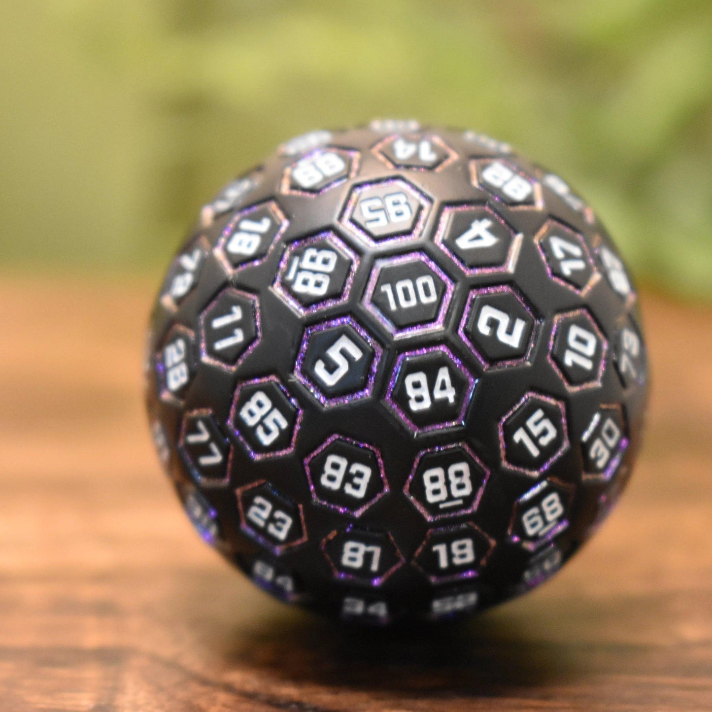The Orb D100 – Purple, White, and Black Metal Percentile Die
