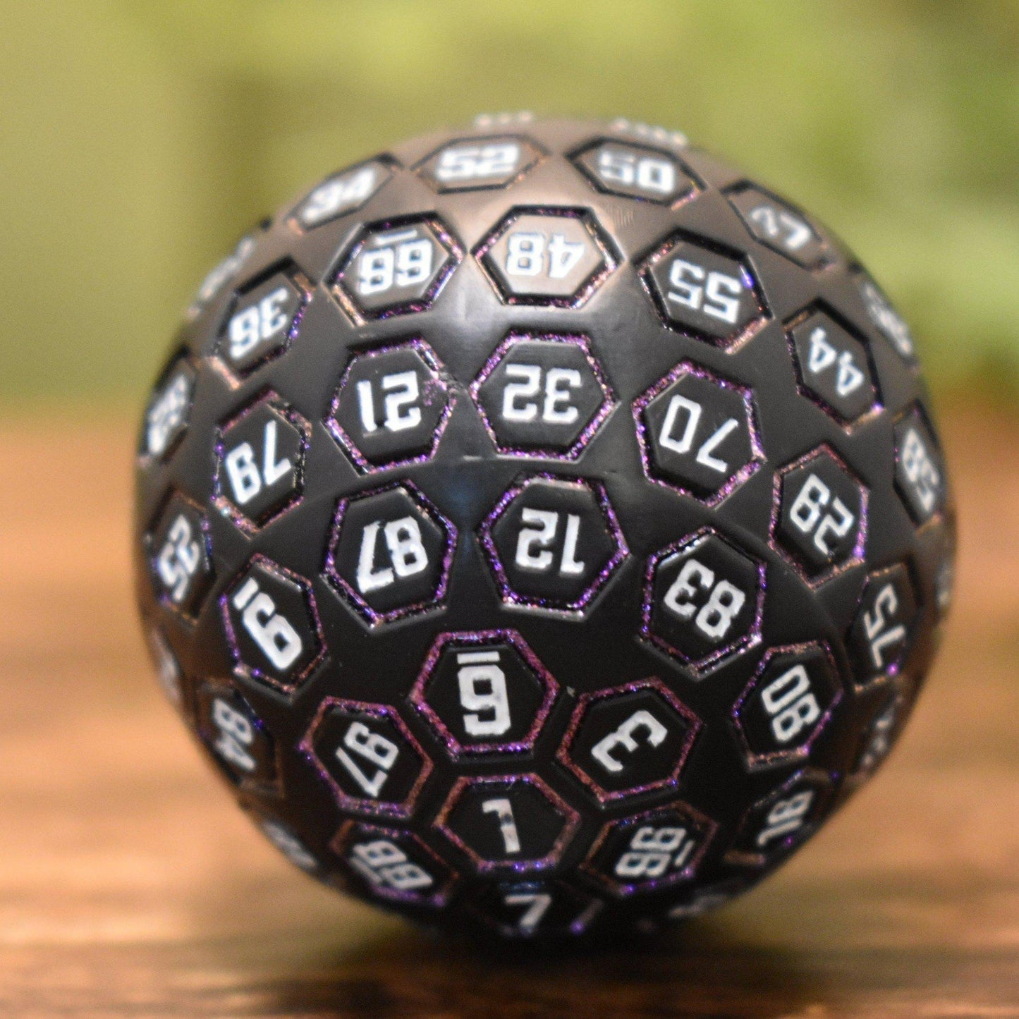 The Orb D100 – Purple, White, and Black Metal Percentile Die